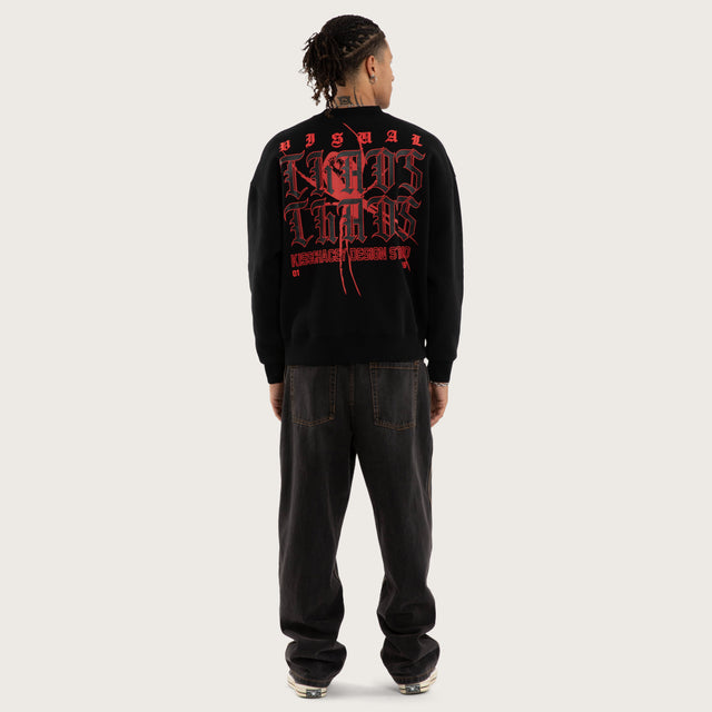 Model wears Protestant Box Fit Sweater Jet Black Jumpers in Black - Image 5