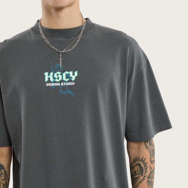 Model wears Archangel Box Fit Tee Pigment Grey T-Shirts in Grey - Image 3