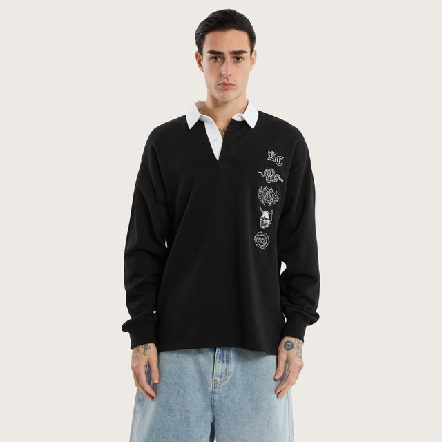 Model wears Stacked Rugby Jumper Jet Black Jumpers in Black - Image 1