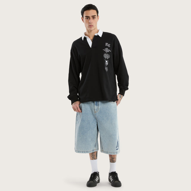 Model wears Stacked Rugby Jumper Jet Black Jumpers in Black - Image 5