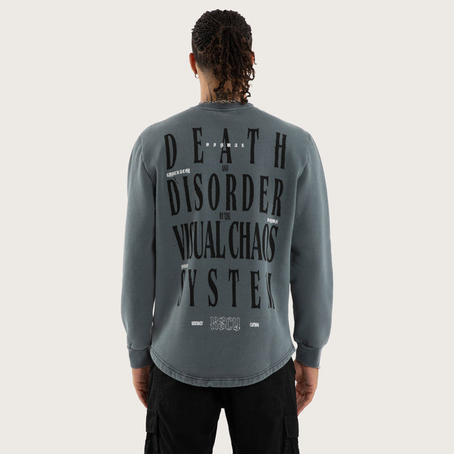 Model wears Rebellion Curved Hem Sweater in Blue Jumpers in Blue - Image 1