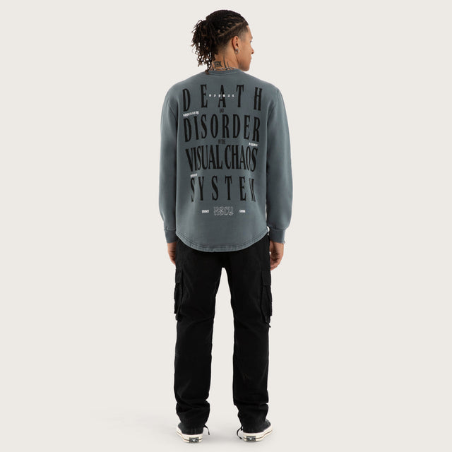 Model wears Rebellion Curved Hem Sweater in Blue Jumpers in Blue - Image 5