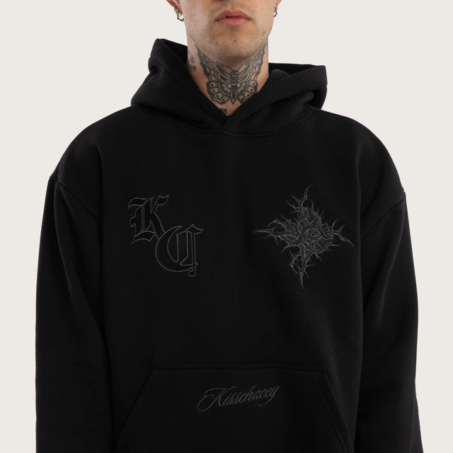 Model wears Paragons Relaxed Hoodie Jet Black Hoodies in Black - Image 3