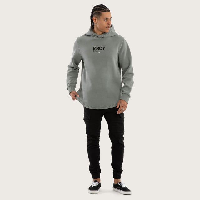 Model wears Reverence Dual Curved Hoodie Pigment Neutral Grey Hoodies Grey – image 2
