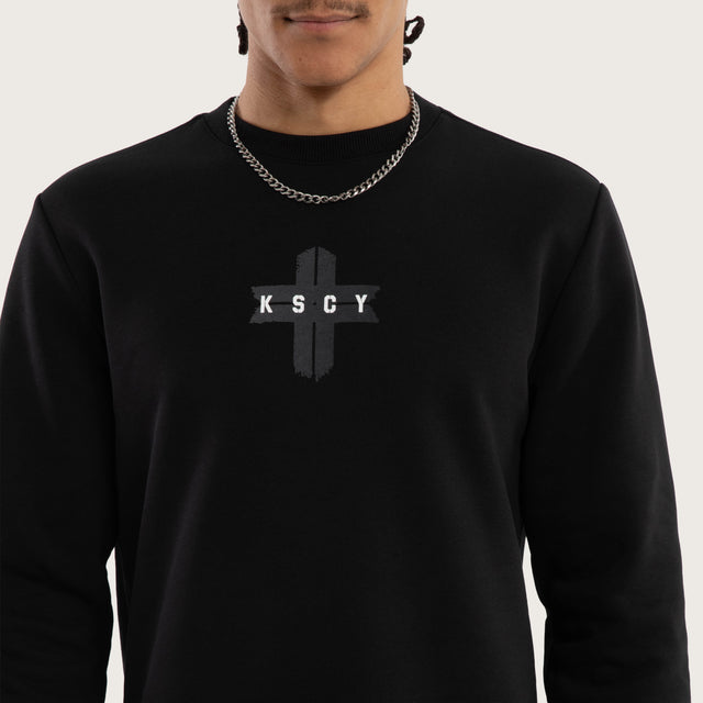 Model wears Salvation Dual Curved Sweater Jet Black Jumpers Black – image 4