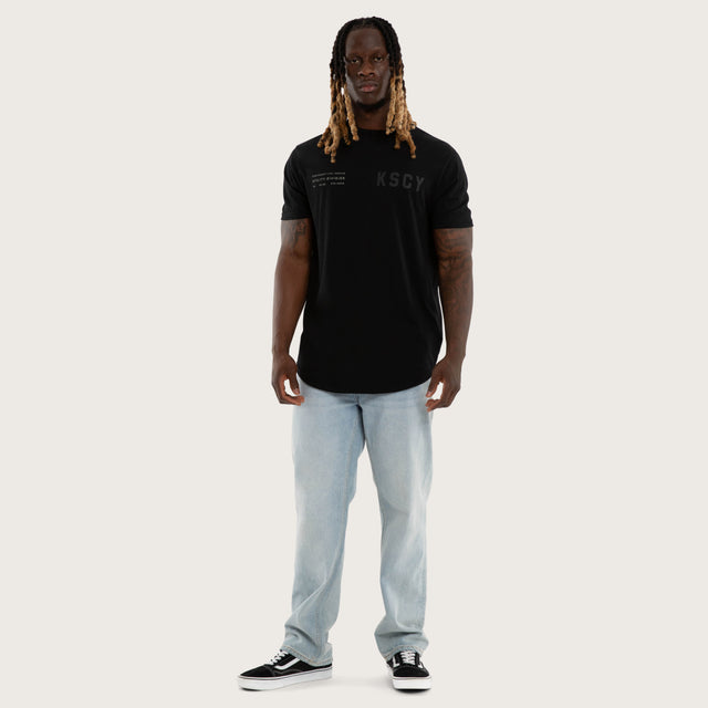 Model wears Existence Dual Curved Tee Jet Black T-Shirts Black – image 5