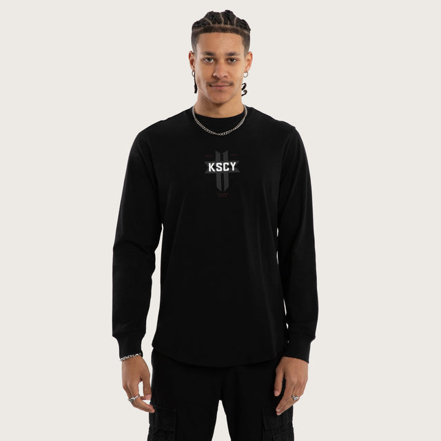 Model wears Mortal Cape Back Longsleeve Tee Jet Black Longsleeve T-Shirts in Black - Image 3