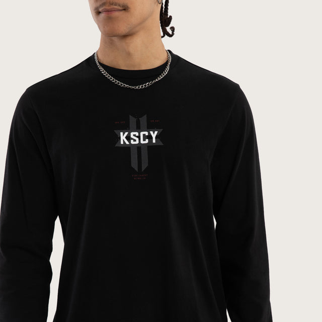 Model wears Mortal Cape Back Longsleeve Tee Jet Black Longsleeve T-Shirts in Black - Image 4