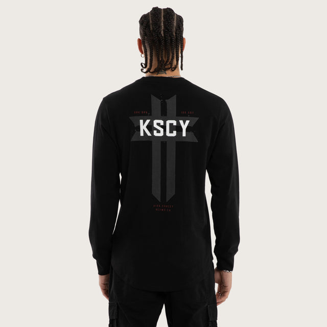 Model wears Mortal Cape Back Longsleeve Tee Jet Black Longsleeve T-Shirts in Black - Image 1