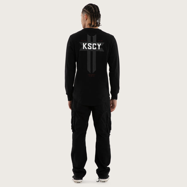 Model wears Mortal Cape Back Longsleeve Tee Jet Black Longsleeve T-Shirts in Black - Image 5