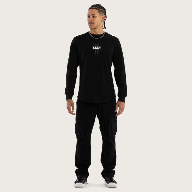 Model wears Mortal Cape Back Longsleeve Tee Jet Black Longsleeve T-Shirts in Black - Image 2