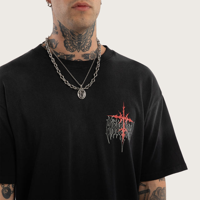 Model wears Embers Box Fit Tee Sunbleach Black T-Shirts in Black - Image 3