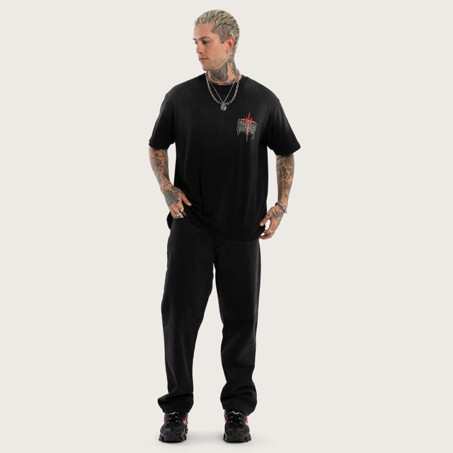 Model wears Embers Box Fit Tee Sunbleach Black T-Shirts in Black - Image 5