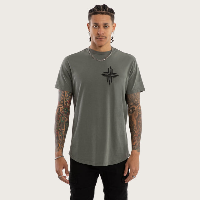 Model wears Preservation Curved Hem Tee in Green T-Shirts in Green - Image 1