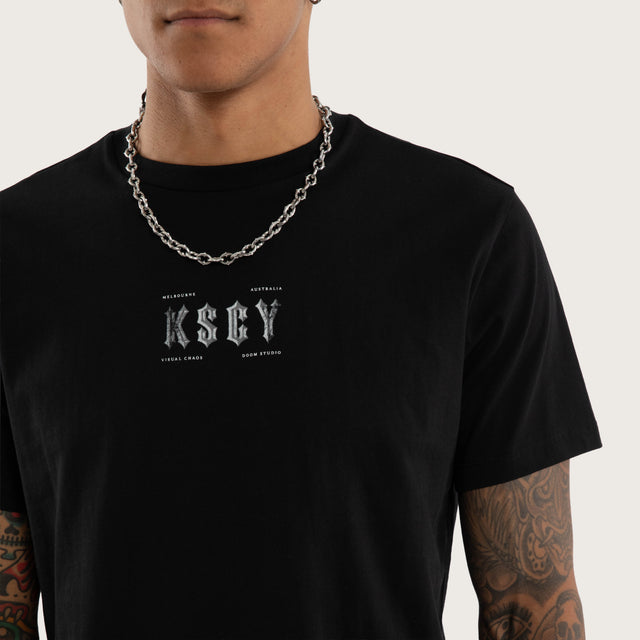 Model wears Encryption Curved Hem Tee Jet Black T-Shirts in Black - Image 3