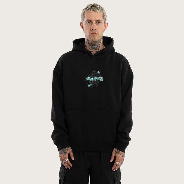 Model wears Despair Oversized Hoodie Anthracite Black Hoodies in Black - Image 1