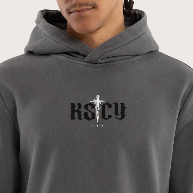 Model wears Existence Dual Curved Hoodie Pigment Charcoal Hoodies in Grey - Image 3
