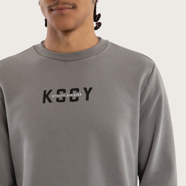 Model wears Griffith Curved Hem Sweater Grey Jumpers in Grey - Image 3