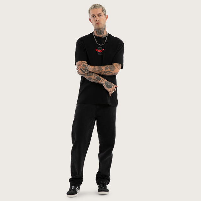 Model wears Pendulum Relaxed Tee Jet Black T-Shirts in Black - Image 5