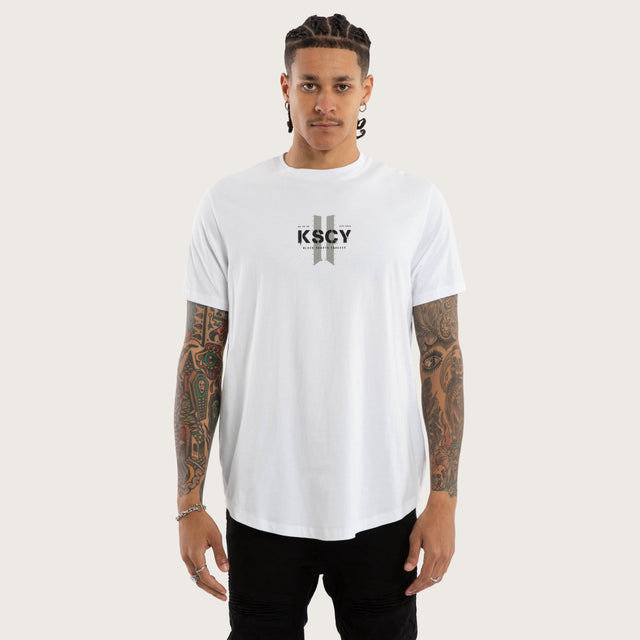 Model wears Inferno Curved Hem Tee Optical White T-Shirts in White - Image 1
