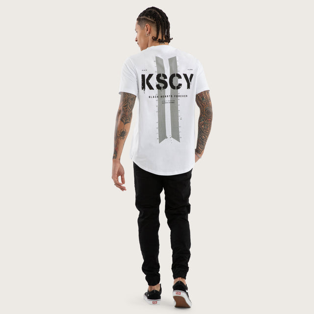 Model wears Inferno Curved Hem Tee Optical White T-Shirts in White - Image 4