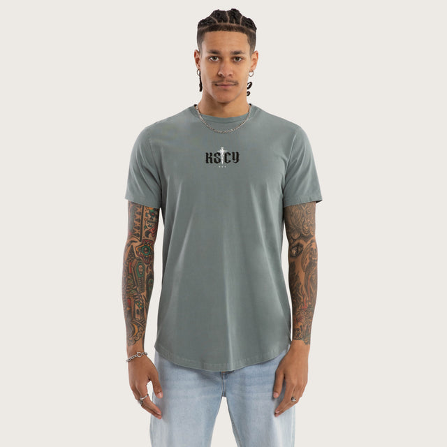 Model wears Exist Dual Curved Tee Pigment Stormy Sea T-Shirts in Blue - Image 2