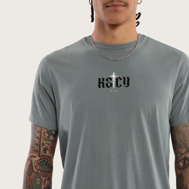 Model wears Exist Dual Curved Tee Pigment Stormy Sea T-Shirts in Blue - Image 3