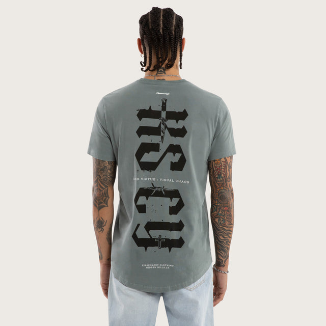 Model wears Exist Dual Curved Tee Pigment Stormy Sea T-Shirts in Blue - Image 1