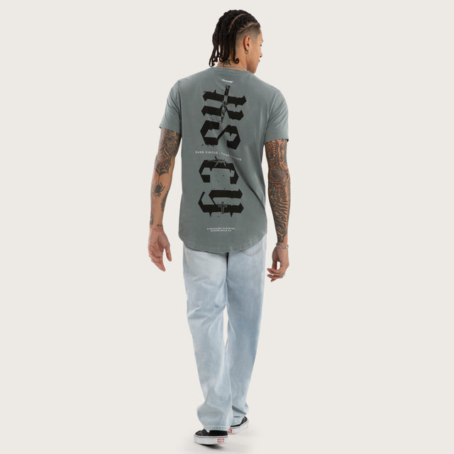 Model wears Exist Dual Curved Tee Pigment Stormy Sea T-Shirts in Blue - Image 4