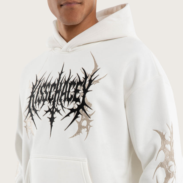 Model wears Cryptic Relaxed Hoodie Natural White Hoodies in White - Image 2