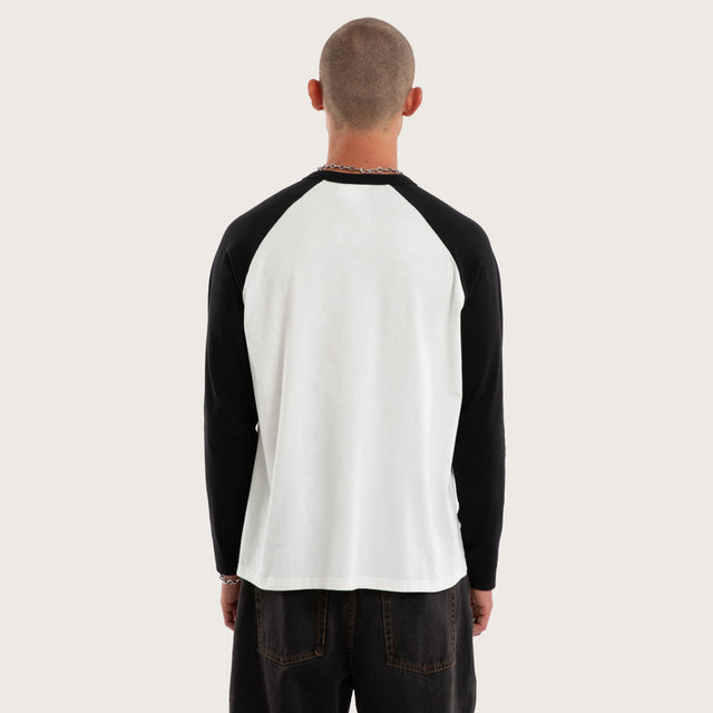 Model wears Scenic Raglan Crew Longsleeve Tee White and Jet Black Longsleeve T-Shirts Black – image 3
