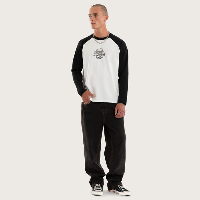 Model wears Scenic Raglan Crew Longsleeve Tee White and Jet Black Longsleeve T-Shirts Black – image 5