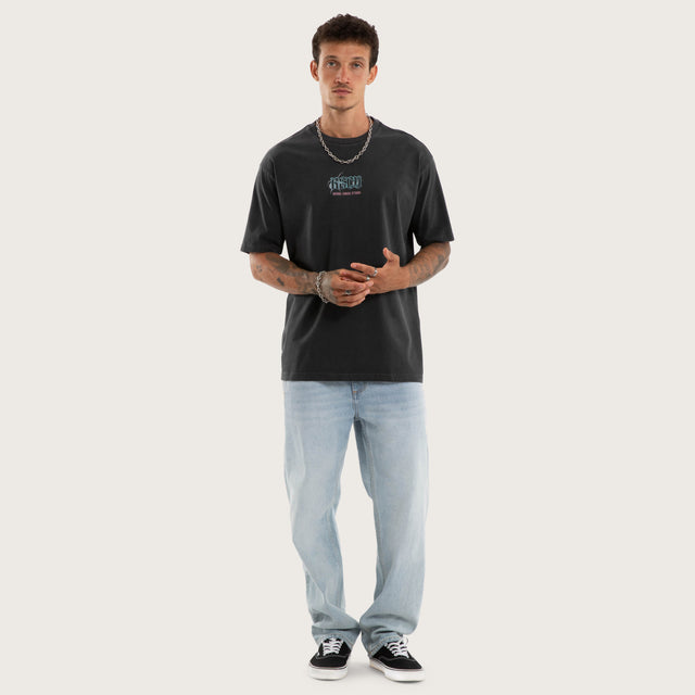 Model wears Wither Box Fit Tee Pigment Black T-Shirts in Black - Image 5