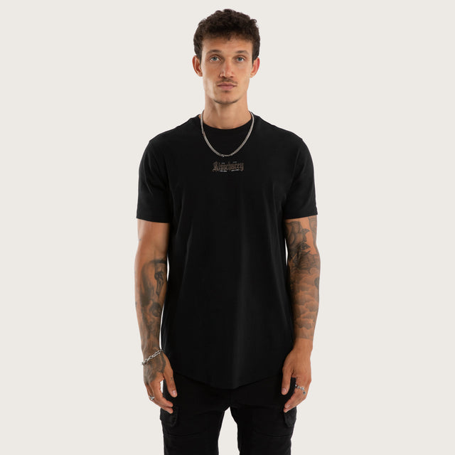 Model wears Recoil Curved Hem Tee Black T-Shirts in Black - Image 1