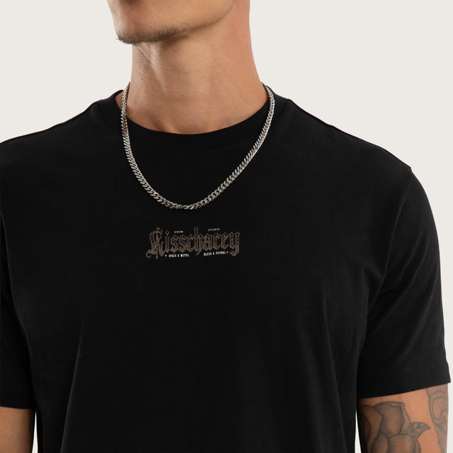 Model wears Recoil Curved Hem Tee Black T-Shirts in Black - Image 3