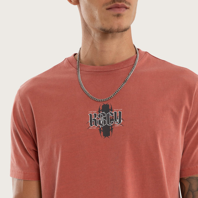 Model wears Exhale Curved Hem Tee Red T-Shirts in Red - Image 3
