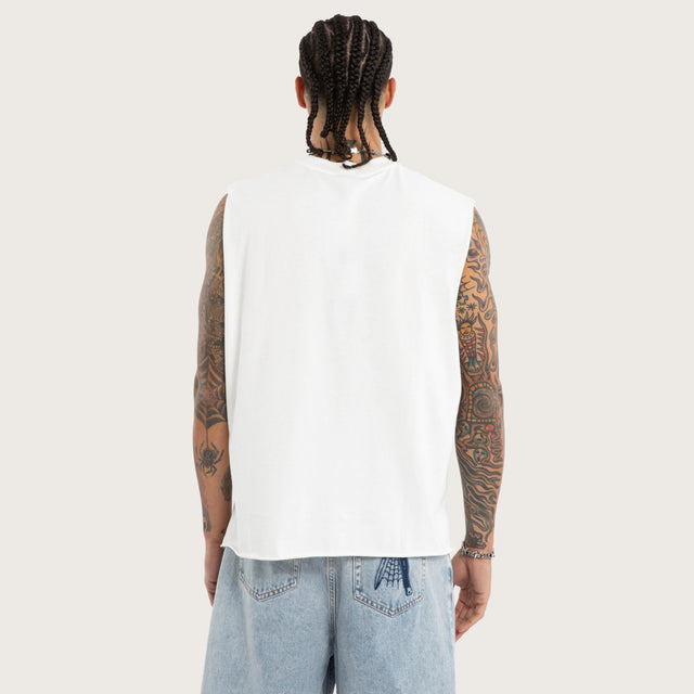 Model wears Darkness Mechanic Muscle Tee White Muscle Tees in White - Image 3
