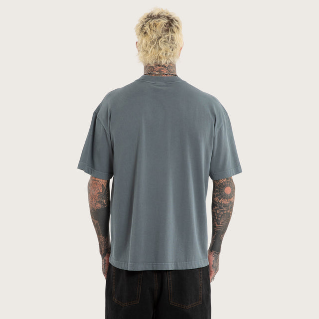 Model wears Oblivion Street Tee Pigment Stormy Weather T-Shirts Blue – image 3