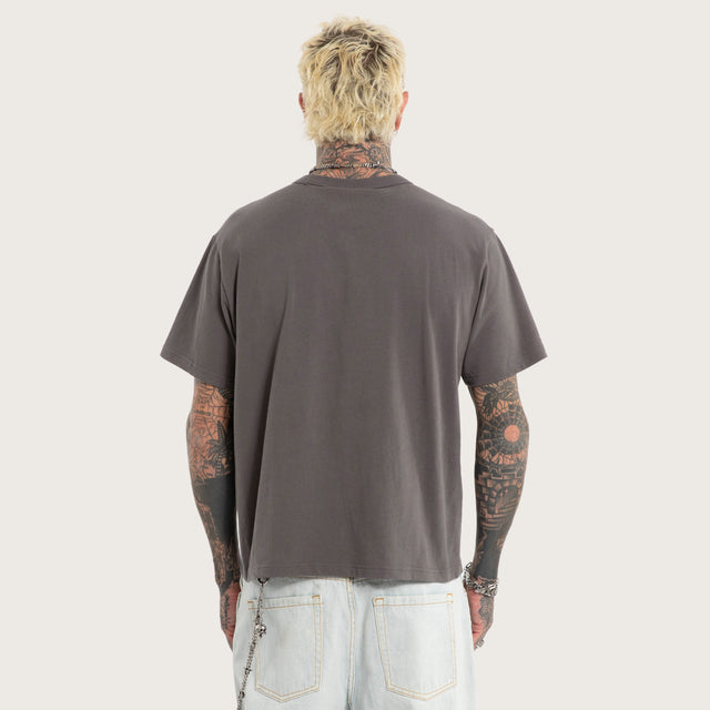 Model wears Luke Walker Error Rocker Tee Charcoal T-Shirts in Grey - Image 6
