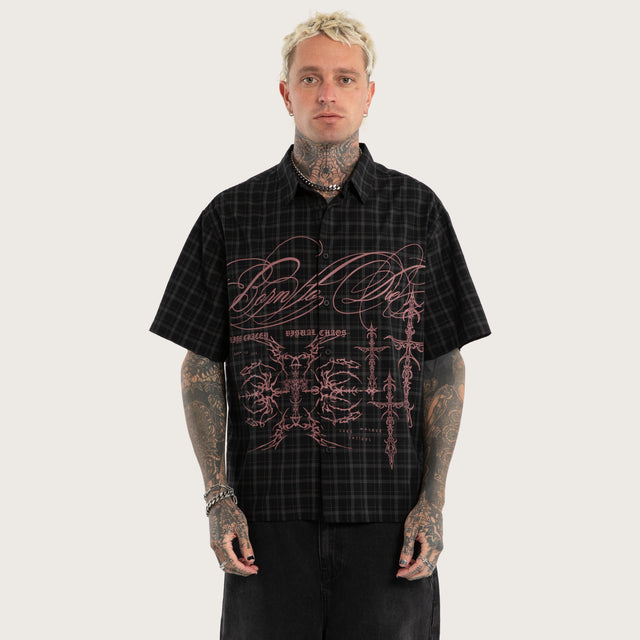 Model wears Luke Walker Phantom Button Up Short Sleeve Shirt Black Check Short Sleeve Shirts in Black - Image 1
