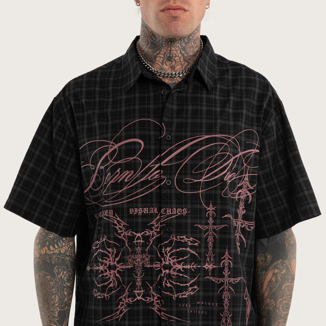 Model wears Luke Walker Phantom Button Up Short Sleeve Shirt Black Check Short Sleeve Shirts in Black - Image 2