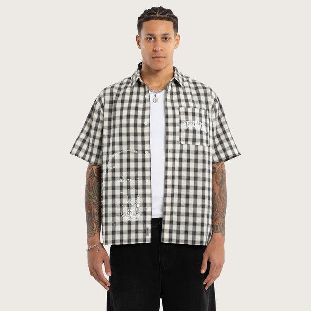 Model wears Reaper Short Sleeve Shirt Grey Check Short Sleeve Shirts in Grey - Image 1