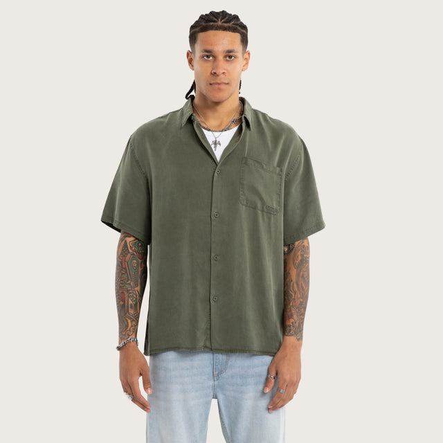 Model wears Acid Sage Short Sleeve Shirt Green Short Sleeve Shirts in Green - Image 1