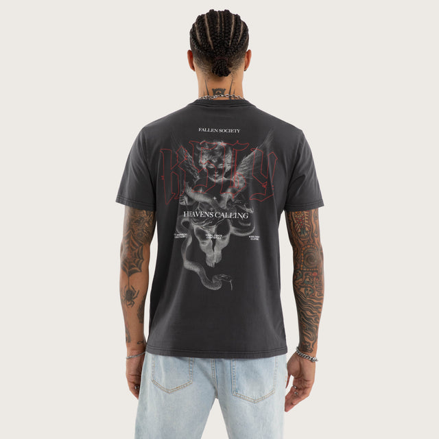 Model wears Heavens Standard Tee Pigment Black T-Shirts in Black - Image 2