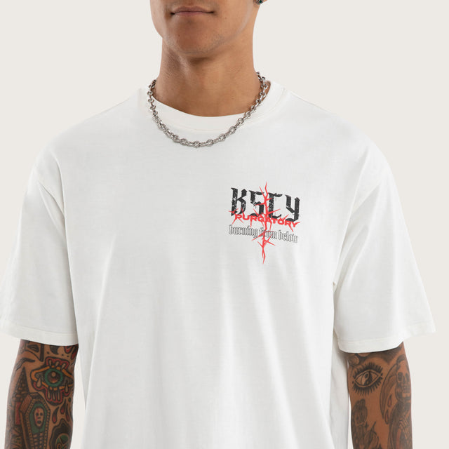 Model wears Burning Box Fit Tee Natural White T-Shirts in White - Image 4