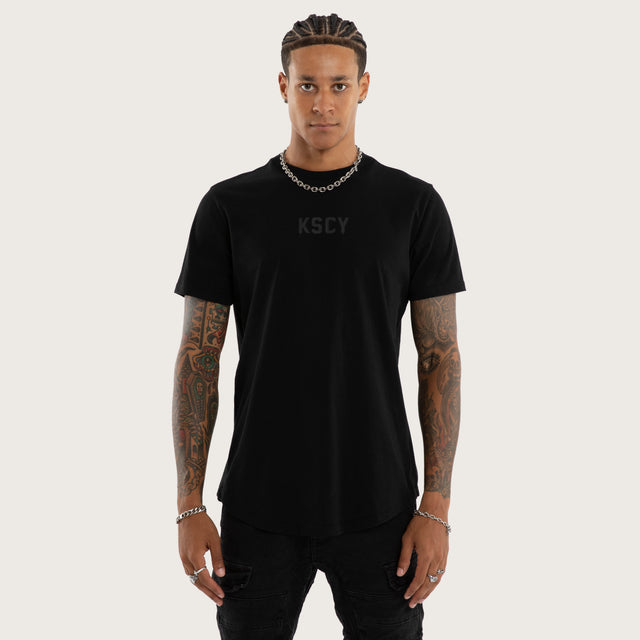 Model wears Frankie Curved Hem Tee Jet Black T-Shirts in Black - Image 2