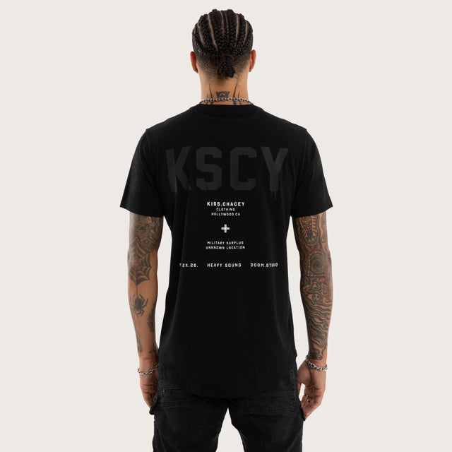 Model wears Frankie Curved Hem Tee Jet Black T-Shirts in Black - Image 1