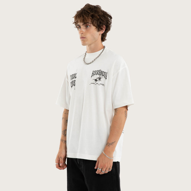 Model wears Relentless Street Tee Natural White T-Shirts in White - Image 3