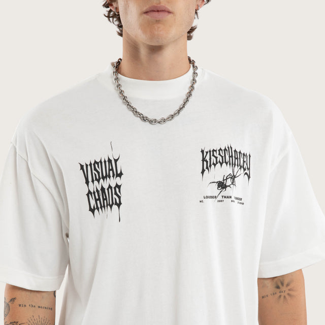 Model wears Relentless Street Tee Natural White T-Shirts in White - Image 4