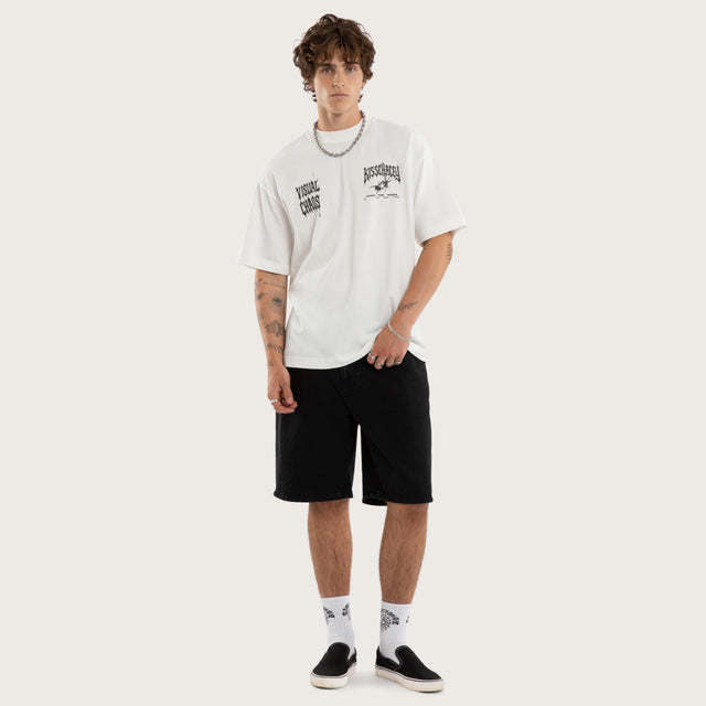Model wears Relentless Street Tee Natural White T-Shirts in White - Image 5